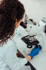 Wall Mural - intelligent female biologist working on her project