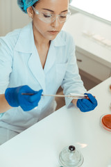 Wall Mural - top view of a smart female researcher experimenting