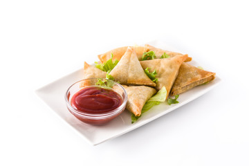 Wall Mural - Samsa or samosas with meat and vegetables isolated on white background . Traditional Indian food.