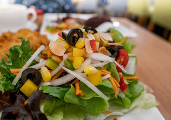 Close up of healthy salad with mayonnaise and Fried prawn  on white dish