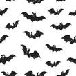 Halloween pattern with cute bat silhouettes. Horror party background. Paper wrap texture.