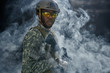 View from cloud of smoke of American soldier in glasses.