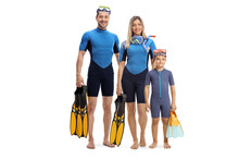 Family In Wetsuits, Holding Diving Flippers And Posing