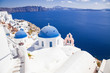 © Melinda Nagy - traditional blue doomed churches and white houses in Santorini, Cyclades islands Greece - amazing travel destination