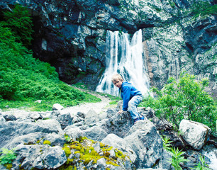 little cute boy playing in mountain river, lifestyle people on summer vacation concept