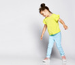 © FAB.1 - Wow. Studio shot of little cute girl playing has fun in the studio, spinning
