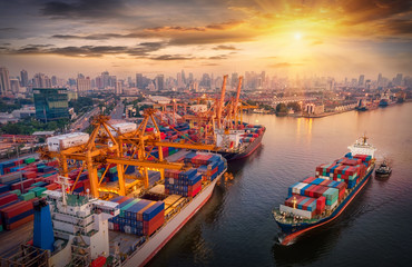 Wall Mural - Logistics and transportation of Container Cargo ship and Cargo plane with working crane bridge in shipyard at sunrise, logistic import export and transport industry background