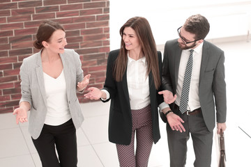 Poster - in full growth.a group of business people standing in the office