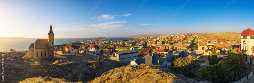 Luderitz in Namibia with lutheran church called Felsenkirche at sunset - obrazy, fototapety, plakaty 