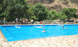© andranik123 - Defocused view. People in the swimming pool