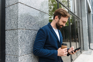 Wall Mural - Attractive young bearded man wearing jacket