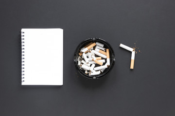 Poster - Top view pile of cigarettes with notebook