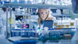 © Gorodenkoff - Research Female Scientist is using a Microscope and a Tablet Computer while Working in a Modern Laboratory. Doing Genetic and Pharmaceutical Researches.