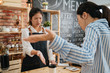 © PR Image Factory - emotional female customer arguing with staff girl at bar counter. Unsatisfied visitor angry about service in cafe shop. woman client dislike coffee drink and yelling at barista lady in morning store