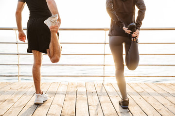 Canvas Print - Attractive sporty young fitness couple