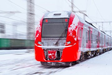 Wall Mural - ice-covered multiple-unit train rides by rail in winter