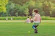 © JinnaritT - Kid enjoy to playing with little ball on green field