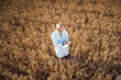 © Kzenon - Scientist doing field test of new GMO grain for better yield