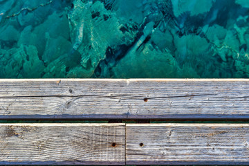 Old wooden dock and turquoise water