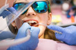 © Dmitry Naumov - Preteen girl receiving dental filling procedure in pediatric dental clinic