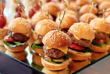 Buffet Table With Mini Hamburgers At Luxury Wedding Reception, Copy Space. Serving Food And Appetizers At Restaurant. Catering Banquet Table