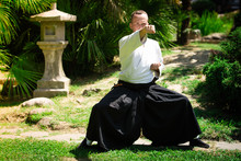 Young Serious Man Aikido Master In Traditional Costume