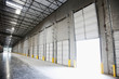 © Mint Images - Open door at loading dock in warehouse