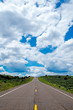 A lone road in Utah with spectacular clouds.
