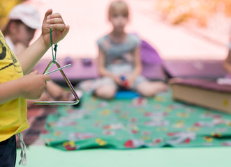 Triangle percussion musical instrument. Music lesson for children