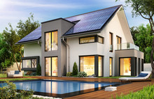 Modern House With Solar Panels On The Gable Roof