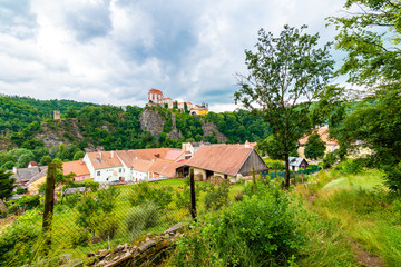 Wall Mural - View of beautiful castle Vranov nad Dyji, Moravian region in Czech republic. Ancient chateau built in baroque style, placed on big rock above river near the Vranov village. Cloudy weather.