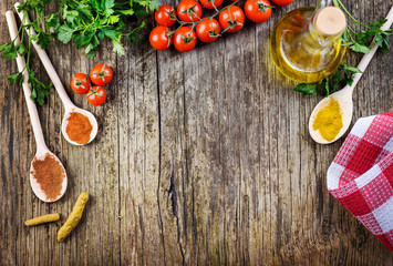 Top view of various food ingredients on vintage wooden table.