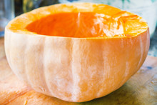 Half A Peeled Pumpkin Stands On A Table Close-up