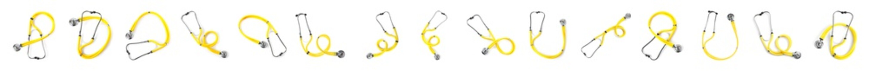 Sticker - Set of yellow stethoscopes on white background, top view. Medical device