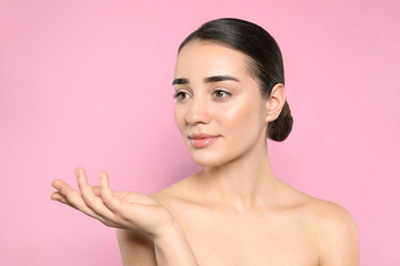 Poster - Portrait of young woman with beautiful face against color background