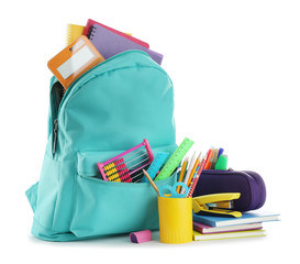 bright backpack with school stationery isolated on white