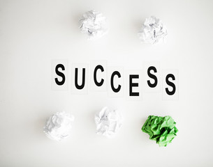 Success word written on white table. Copy space