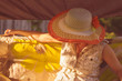 © Mihail - adult woman in summer hat sitting on a swing in the yard