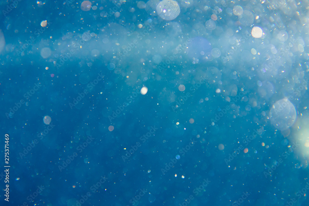 sunny blue underwater background with particles - obrazy, fototapety, plakaty 