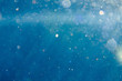 sunny blue underwater background with particles