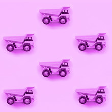 Many Small Purple Toy Trucks On Texture Background Of Fashion Pastel Purple Color Paper