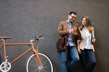 Office woman with business man couple enjoying break while talking flirting outdoor