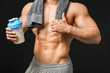© Pixel-Shot - Sporty man with protein shake on dark background