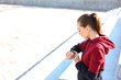 © Pixel-Shot - Sporty young woman checking her pulse outdoors