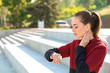 © Pixel-Shot - Sporty young woman checking her pulse outdoors