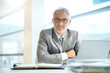 © goodluz - Portrait of mature businessman sitting in office looking at camera