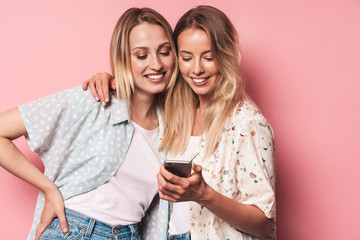 Poster - Two attractive blonde girls wearing summer outfit