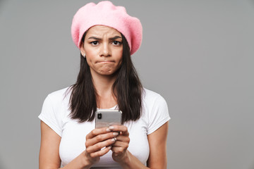 Sticker - Attractive young brunette woman wearing beret standing