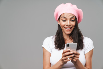 Wall Mural - Attractive young brunette woman wearing beret standing