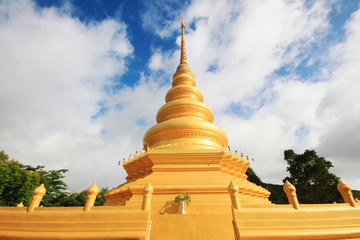 Golden pagoda in temple located on the mountain and very beautiful view in Chiangrai Province, Thailand.